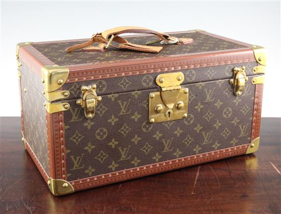 A Louis Vuitton rectangular vanity case, with key, 16in.